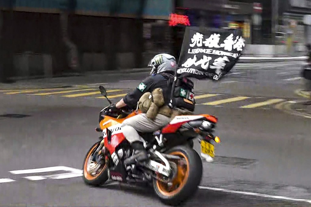 Leon Tong rode his motorcycle into police officers during a July 1 rally last year. Photo: NowTV News