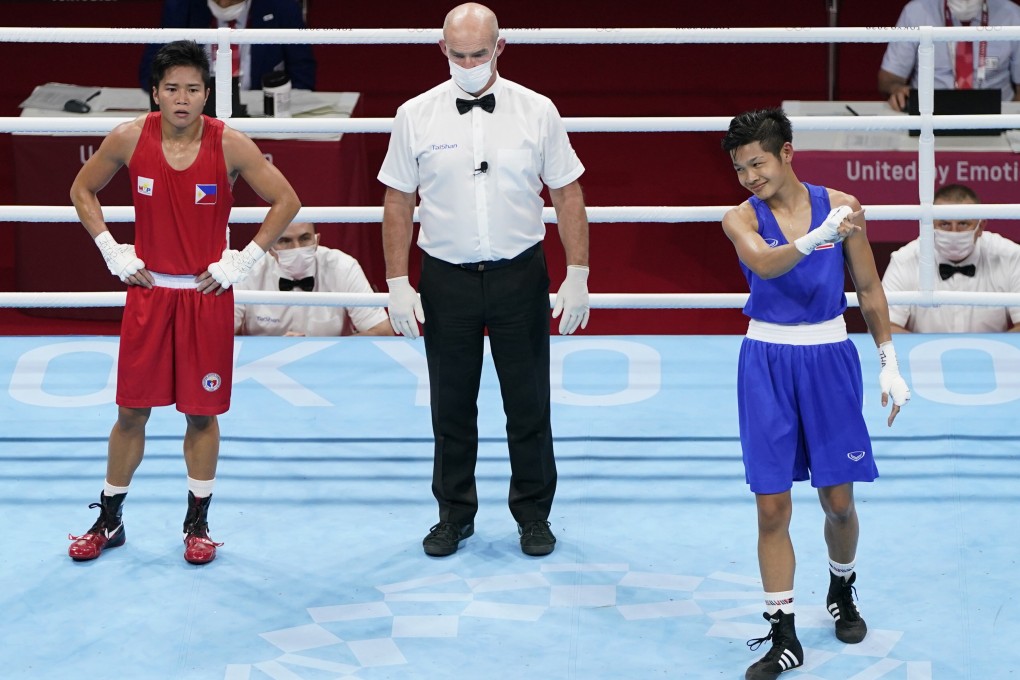 Jutamas Jitpong celebrates her win against Irish Magno of Philippines in the flyweight last-16. Photo: AP
