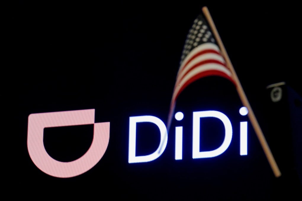 An American flag is seen in front of the logo for Chinese ride hailing company Didi during the initial public offering on the New York Stock Exchange floor in June. Photo: Reuters