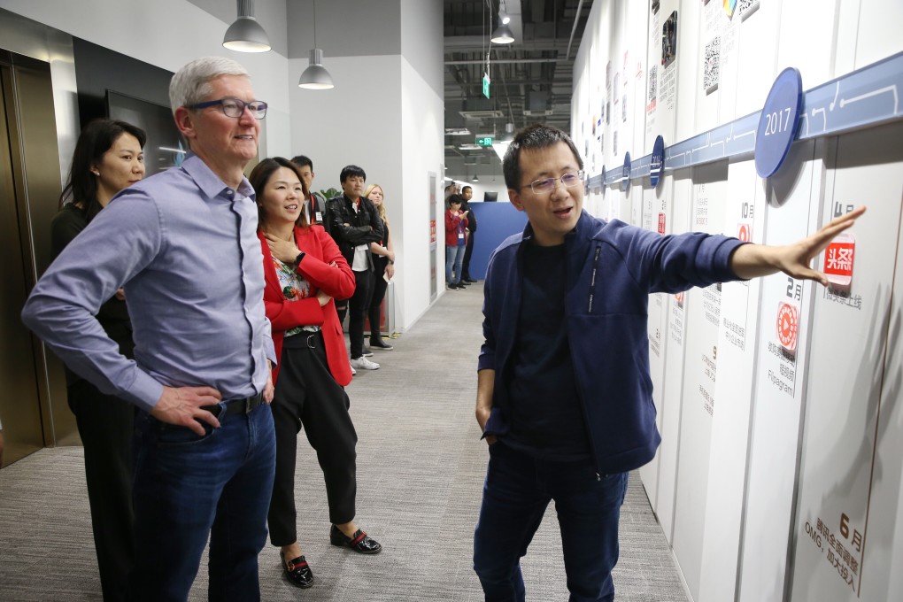 ByteDance founder Zhang Yiming shows Apple chief executive Tim Cook around the TikTok operator’s Beijing headquarters during a meeting on October 11, 2018. Photo: ImagineChina