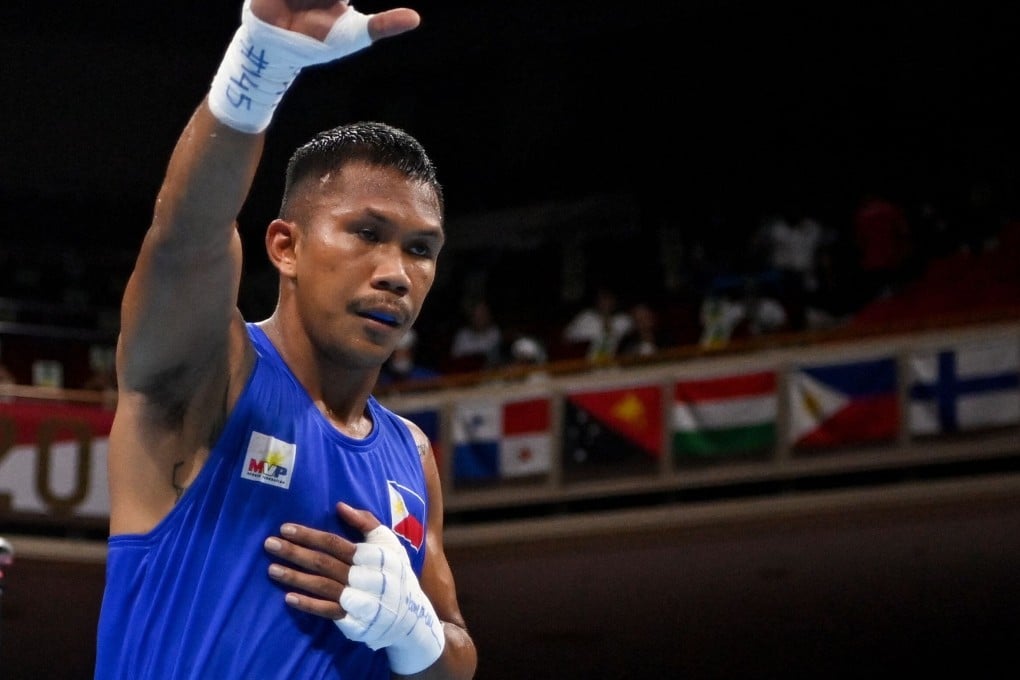Philippines‘ Eumir Marcial celebrates after winning against Algeria’s Younes Nemouchi in their men’s middleweight bout at the Tokyo 2020 Olympics. Photo: AFP