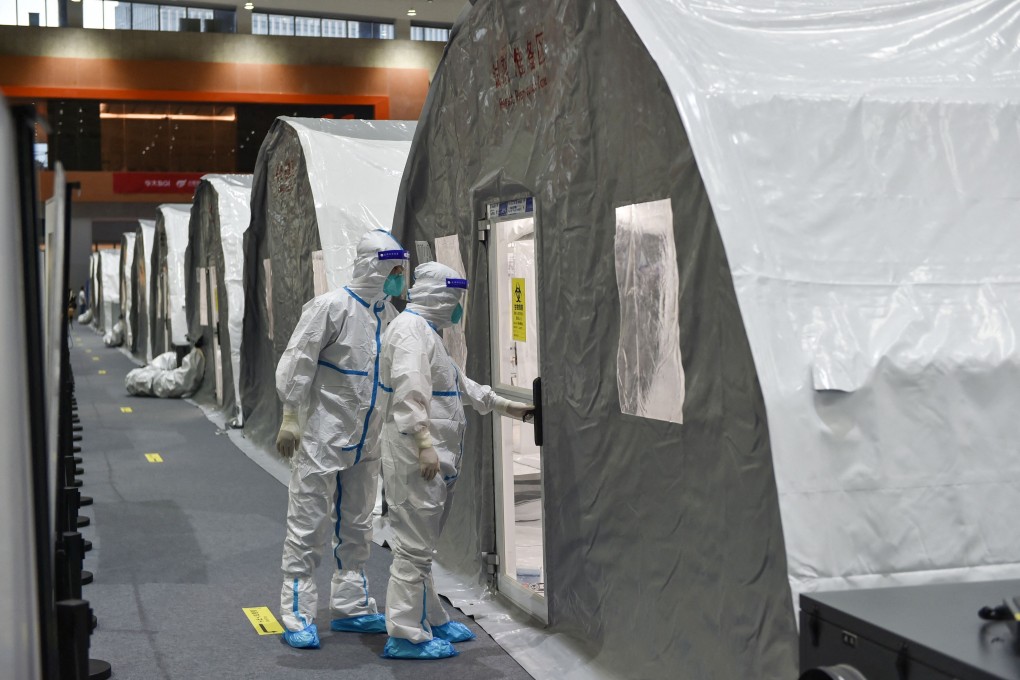 Checks are made at a temporary laboratory used for Covid-19 testing in Nanjing, Jiangsu province. A cluster at the airport is believed to have led to cases elsewhere in Nanjing as well as in other Chinese cities. Photo: AFP