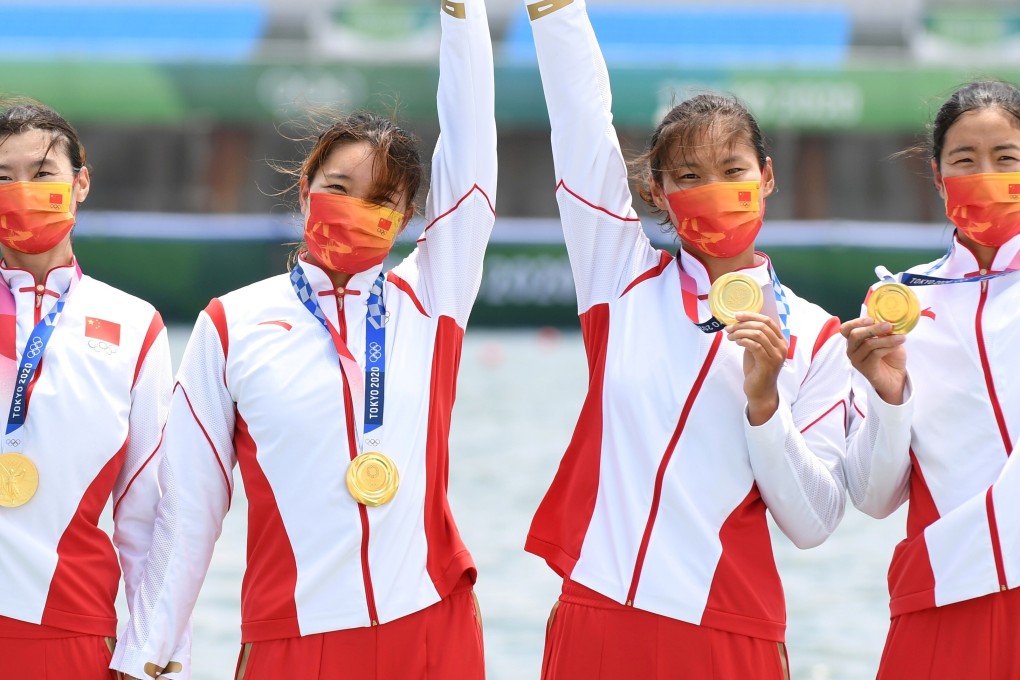 China’s women’s quadruple sculls team of Chen Yunxia, Zhang Ling, Lyu Yang and Cui Xiaotong celebrate with their gold medals. Photo: Reuters