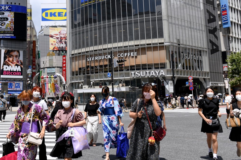 Pedestrians cross a street in Shibuya district, Tokyo. Photo: Bloomberg