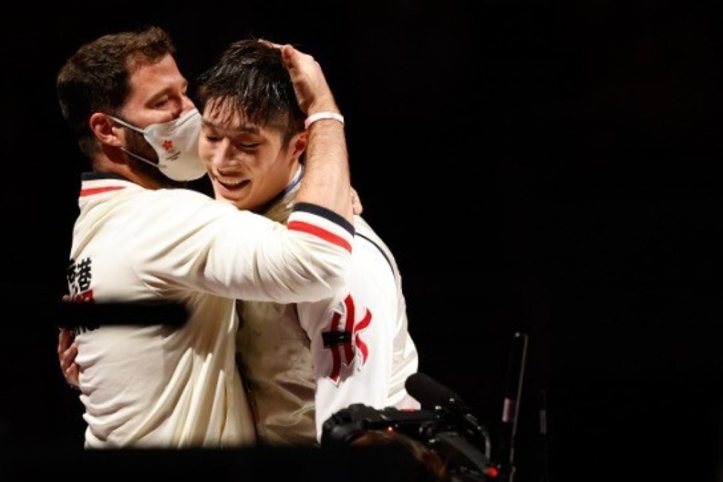 Coach Greg Koenig hugs Cheung Ka-long after the fencer’s heroics in the men’s individual foil in Tokyo Photo: Hong Kong Olympic Committee