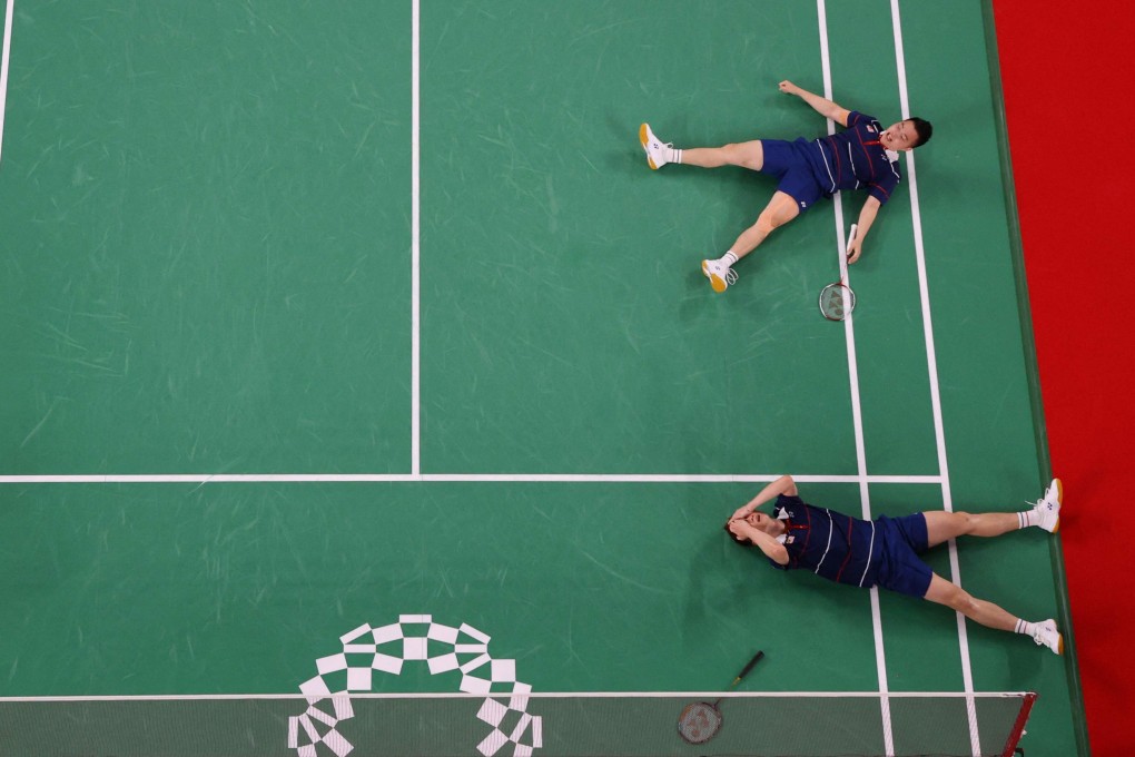 Malaysia’s Soh Wooi Yik and Aaron Chia celebrate winning their men’s doubles badminton bronze medal match against Indonesia’s Mohammad Ahsan and Hendra Setiawan. Photo: AFP