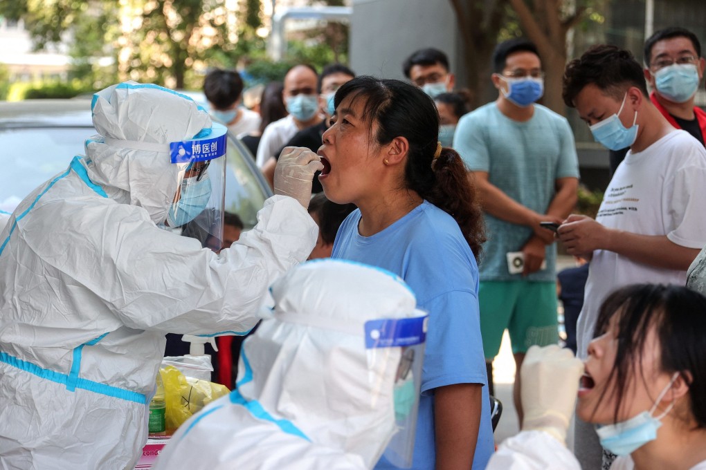 A woman receives a Covid-19 test in Zhengzhou. Photo: AFP