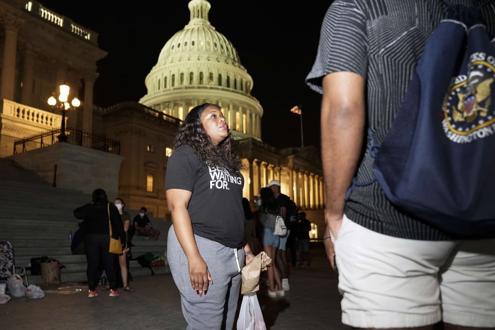 Cori Bush speaks to supporters as she spends the night outside the US Capitol in Washington on Saturday. Photo: Getty Images / AFP