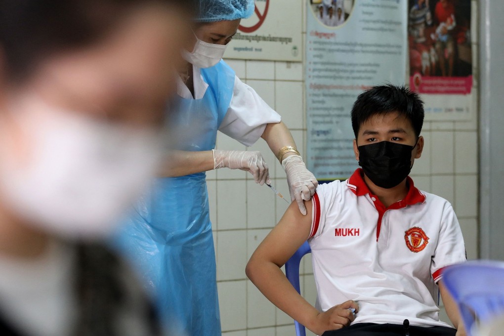 A young man receives a Sinovac Covid-19 vaccine shot in Phnom Penh. Photo: AFP