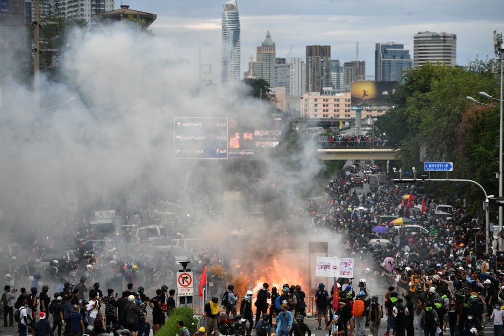 Protesters burn mock body bags, representing Covid-19 casualties, and a puppet depicting Thai Prime Minister Prayuth Chan-ocha during an anti-government march in Bangkok earlier this month. Photo: Reuters
