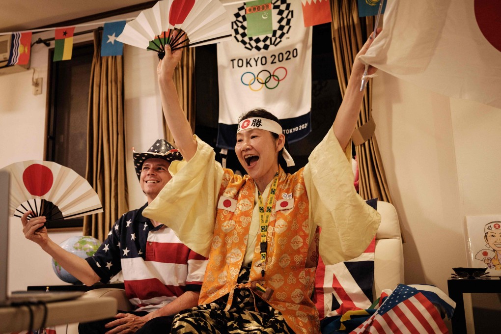 Olympic superfan Kyoko Ishikawa, who has attended every Summer Olympics in the past 30 years, and her husband John Sledge at their home in Tokyo. Photo: AFP