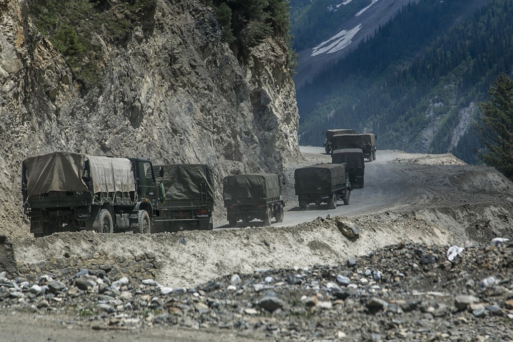 An Indian army convoy travels through a high mountain pass bordering China, on June 13 in Ladakh, India. Photo: Getty Images/TNS