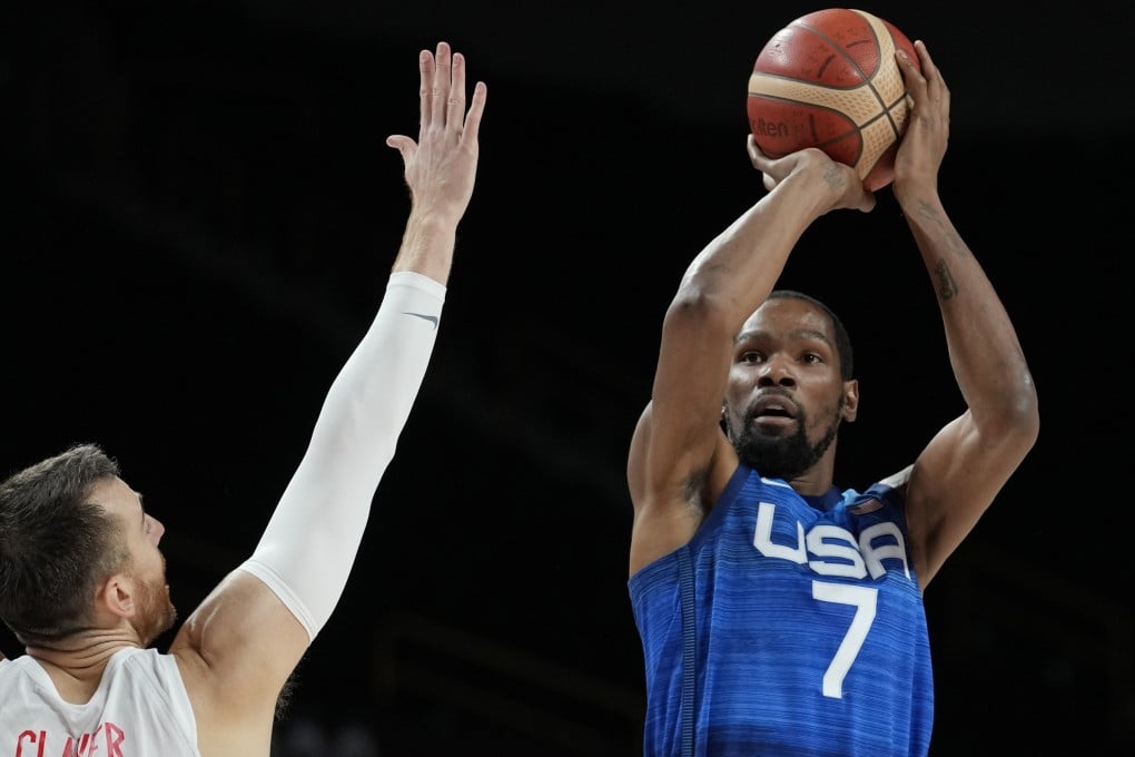 Kevin Durant shoots over Spain’s Victor Claver as the USA advances to the semi-finals at the Olympic Games. Photo: AP