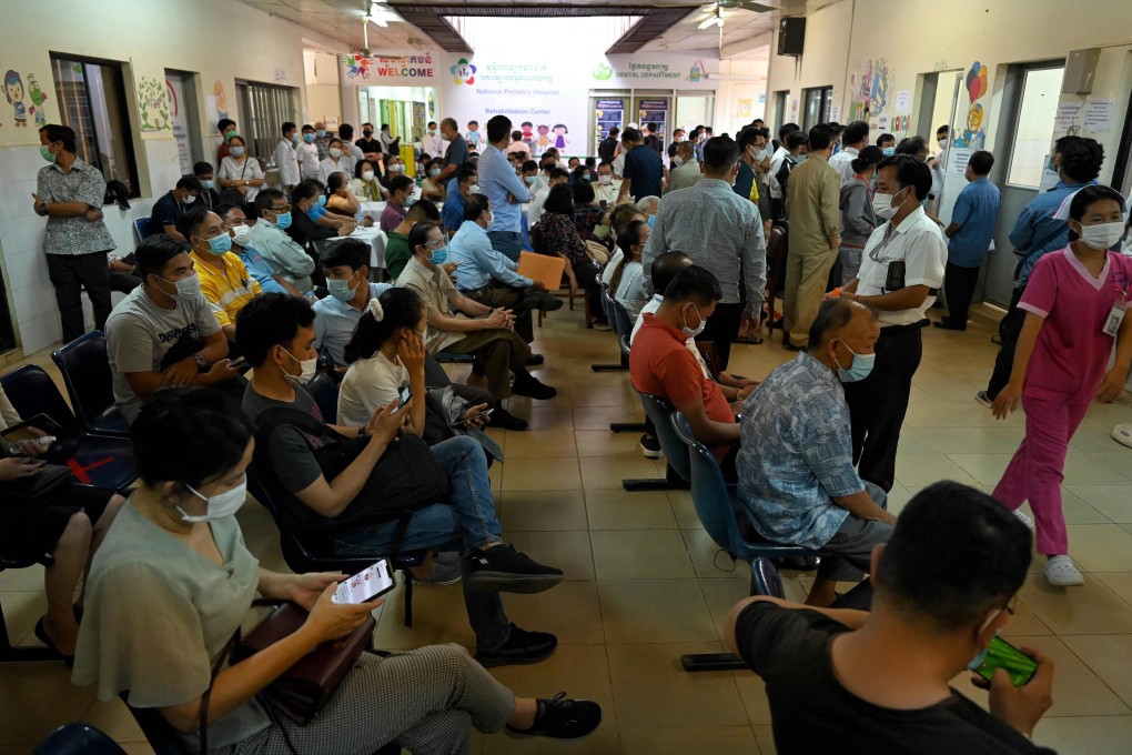 People wait to get vaccinated against Covid-19 at a hospital in Phnom Penh, Cambodia. Photo: AFP