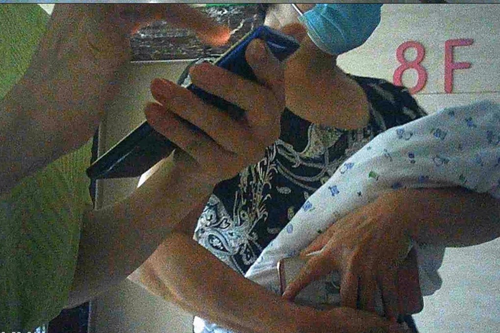 An activist captured the moment when he met the post-partum nurse for the baby he was pretending to buy. Photo: AFP