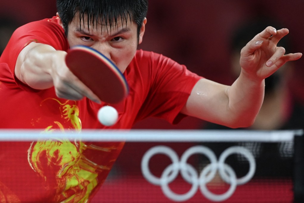 China's Fan Zhendong competes against South Korea's Jang Woo-jin during their men's team semi-final table tennis match at the Tokyo Olympics. Photo: AFP