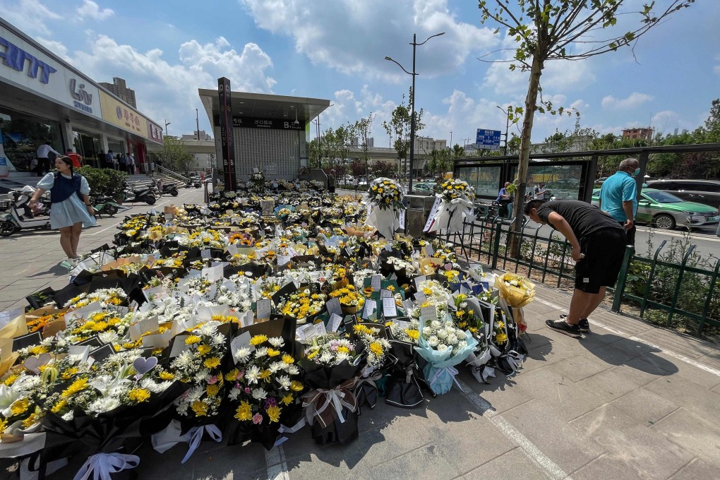 A tribute to flood victims in front of a subway station in Zhengzhou. Photo: STR/AFP