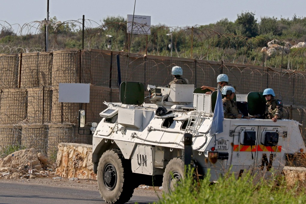 A Unifil convoy drives past one of their outposts near the border with Israel. Photo: AFP