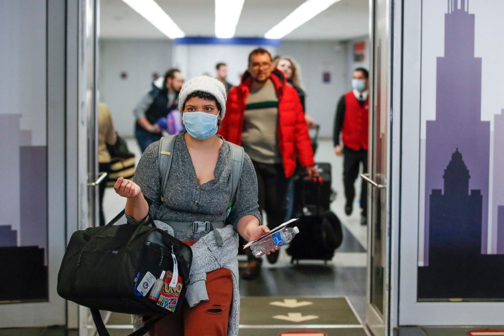 Travellers arrive at the international terminal of O'Hare Airport in Chicago in March last year. Photo: AFP