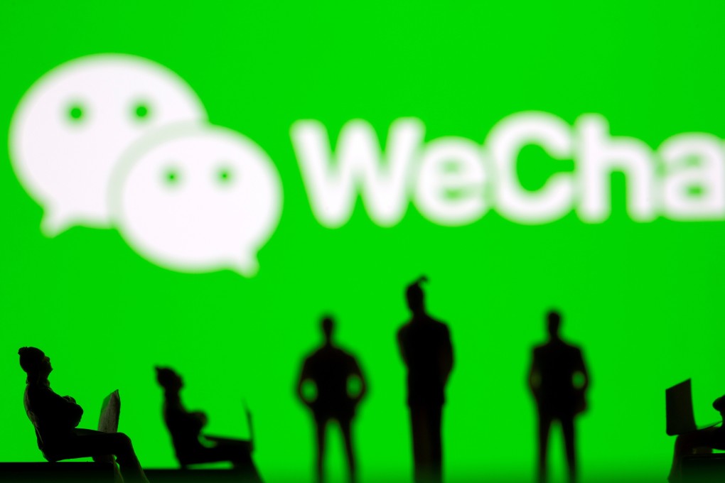 Small toy figures are seen in front of WeChat logo in this illustration picture. Photo: Reuters