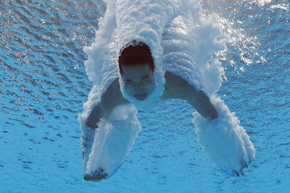 Quan Hongchan hits the water during the women’s 10m platform diving final at the Tokyo 2020 Olympics. Photo: Reuters
