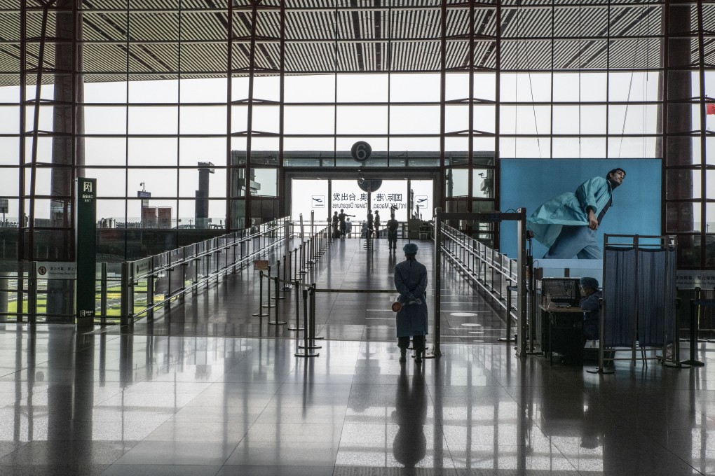A Covid-19 screening station in a deserted departure hall at Beijing Capital International Airport on August 5, as China imposed new travel and movement restrictions amid a Delta-driven outbreak, with hundreds of cases scattered across half the country. Photo: Bloomberg