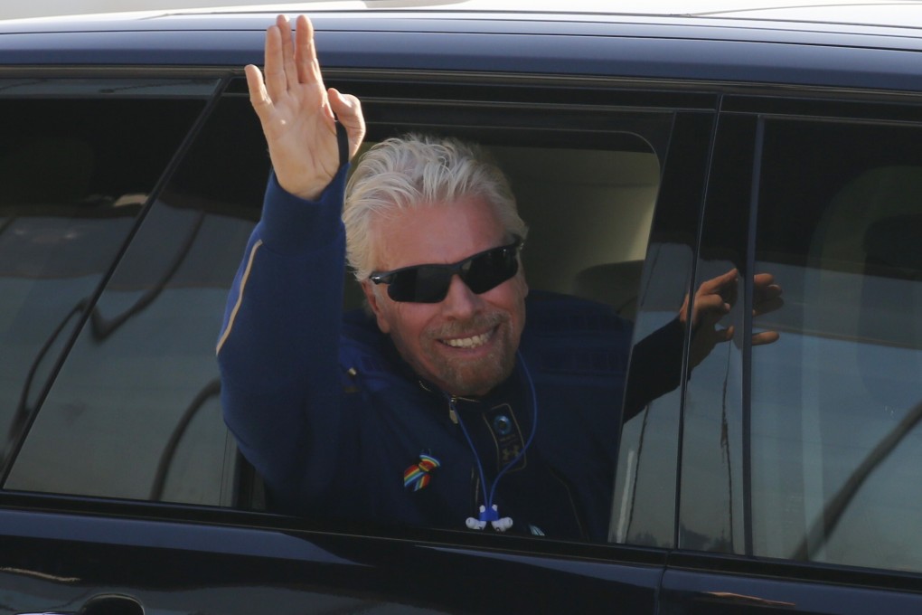 Billionaire entrepreneur Richard Branson departs with his crew before boarding Virgin Galactic's passenger rocket plane VSS Unity in New Mexico in July. Photo: Reuters