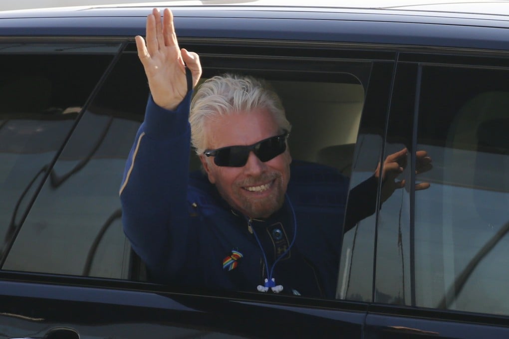 Billionaire entrepreneur Richard Branson departs with his crew before boarding Virgin Galactic's passenger rocket plane VSS Unity in New Mexico in July. Photo: Reuters