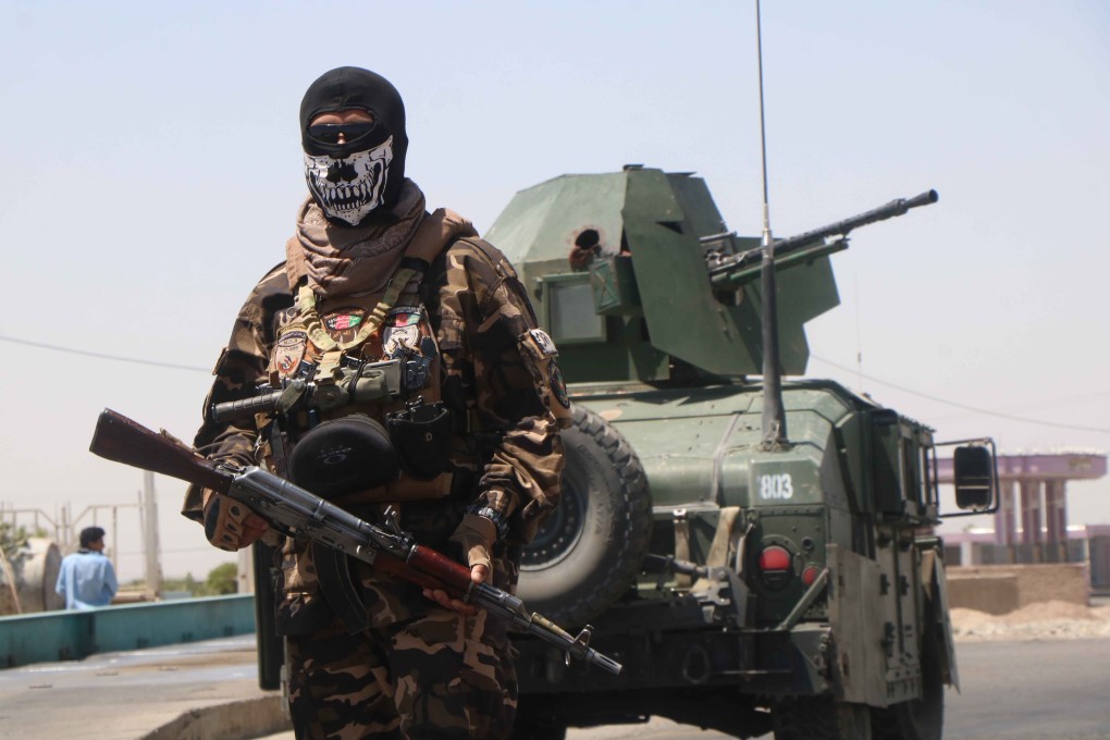 Afghan security officials patrol on August 5 after taking back parts of Herat city following intense fighting with Taliban militants. Photo: EPA