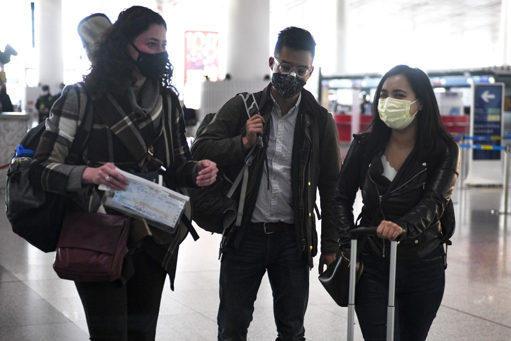 Wall Street Journal reporters (from left) Julie Wernau, Stu Woo and Stephanie Yang departing Beijing in March last year. They were among a number of reporters from three major US newspapers forced to leave China. Photo: AFP
