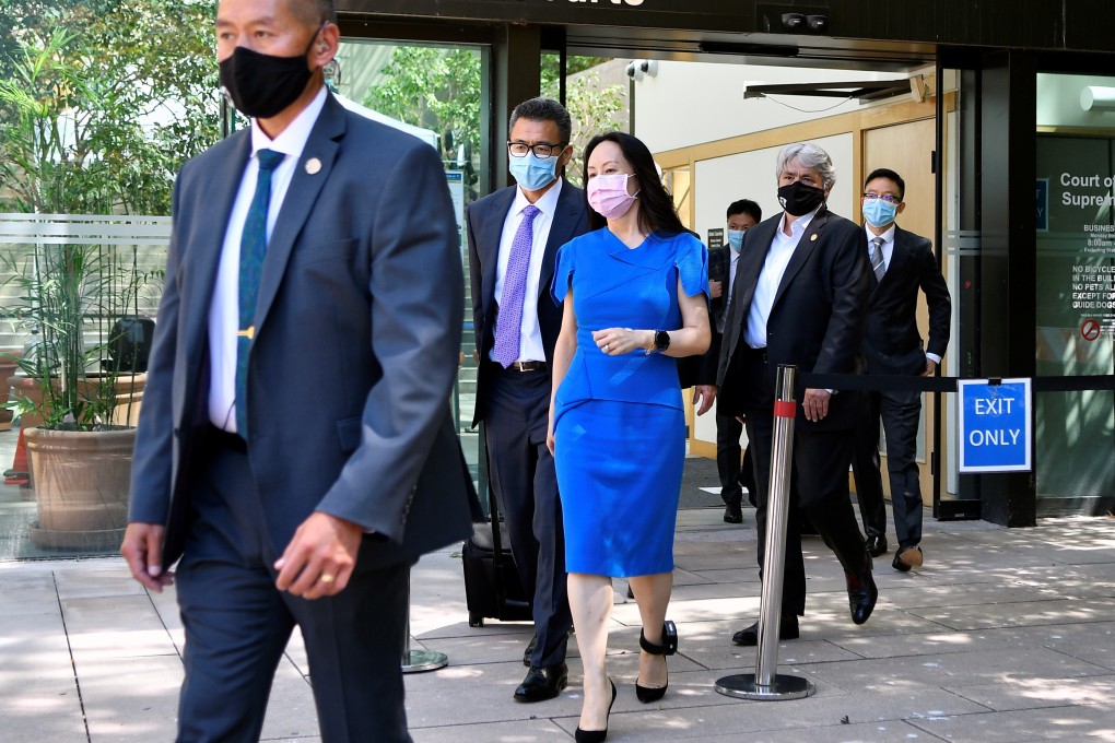 Huawei Technologies chief financial officer Meng Wanzhou, surrounded by guards, leaving the Supreme Court of British Columbia during a lunch break in her extradition case in Vancouver, British Columbia, on Wednesday. Photo: Reuters