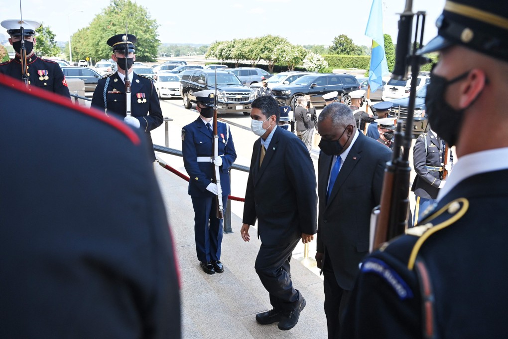 Pentagon chief Lloyd Austin (right) greets Palau President Surangel Whipps in Washington, DC, on Thursday. Photo: AFP