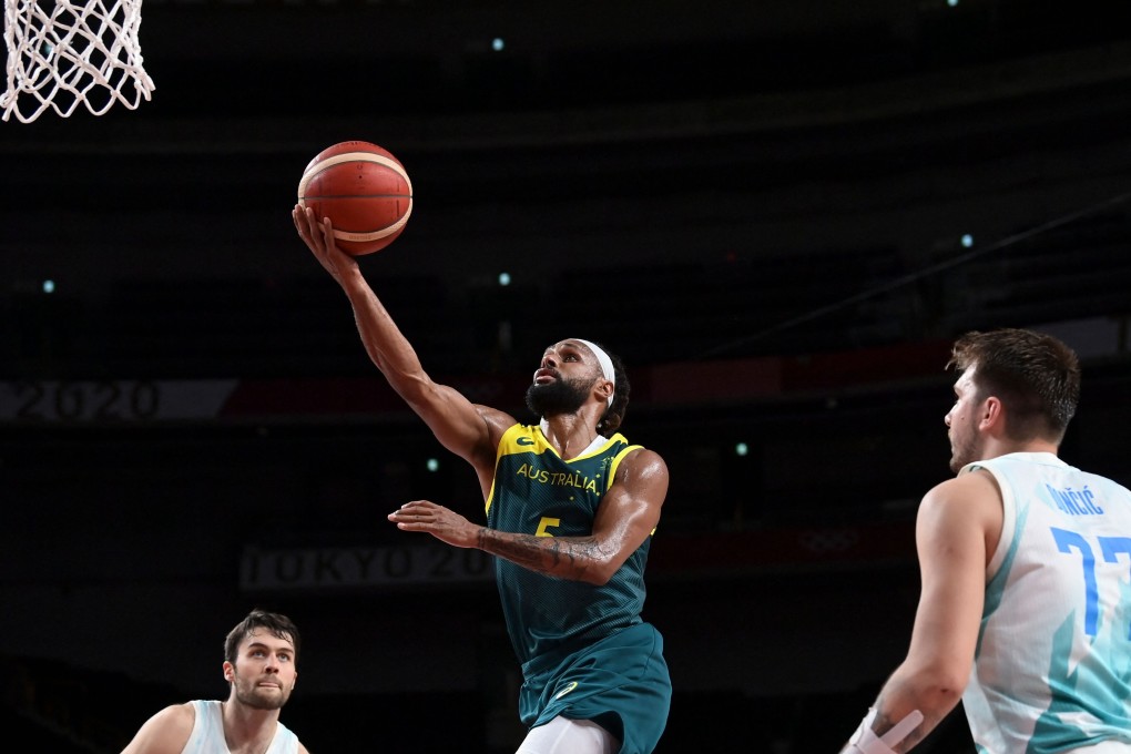 Australia’s Patty Mills goes to the basket past Slovenia’s Luka Doncic during their bronze medal match at the Tokyo 2020 Olympics. Photo: AFP