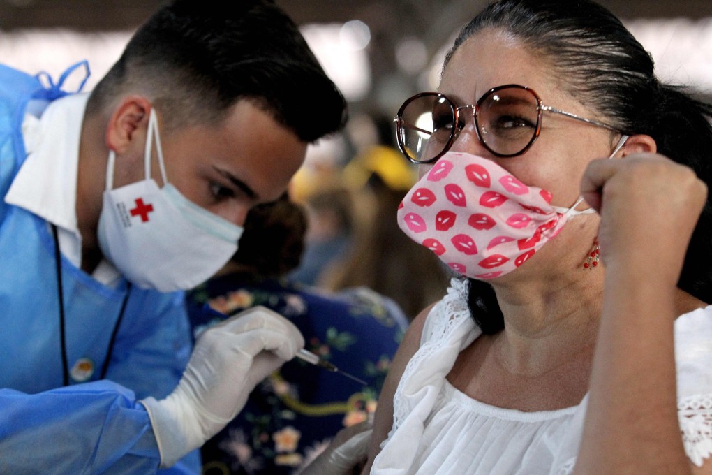 A teacher receives a dose of the CanSino Biologics Covid-19 vaccine at an inoculation centre in Guadalajara, Mexico, on April 28. Photo: AFP