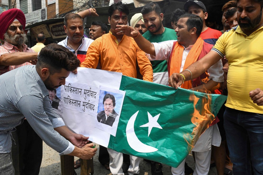 Indian activists burn Pakistan’s flag. Photo: AFP