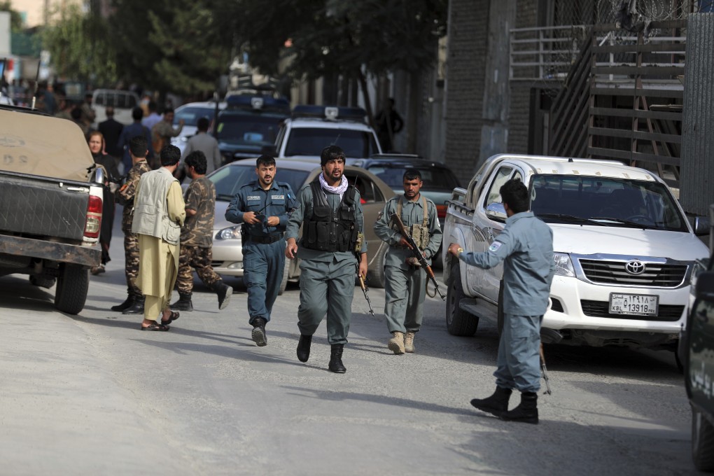 Afghan security staff arrive at the area where Dawa Khan Menapal, the director of Afghanistan’s Government Information Media Centre, was shot dead in Kabul, Afghanistan on Friday. Photo: AP