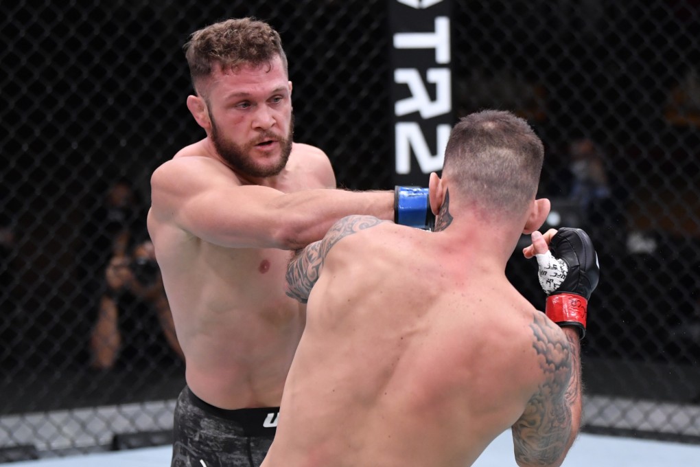 Rafael Fiziev punches Renato Moicano at UFC 256. Photo: Zuffa LLC