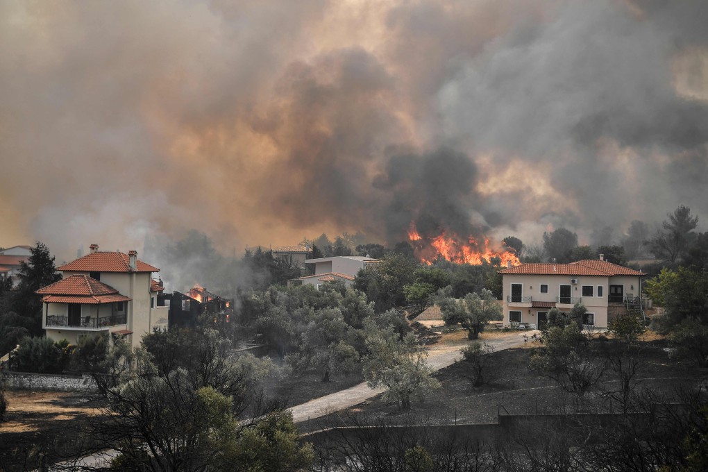 Flames spread in the village of Afidnes, north of Athens, Greece on Friday. Photo: AFP