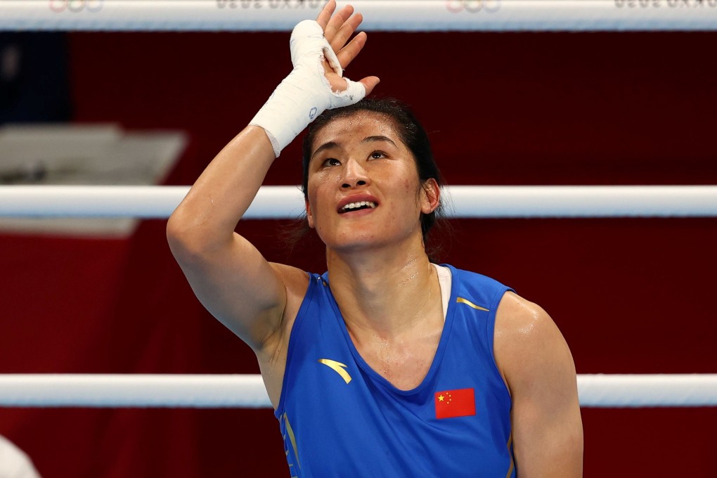 Li Qian of China celebrates her win against Zenfira Magomedalieva of the Russian Olympic Committee in the Tokyo 2020 Olympic Games boxing women’s middleweight semi-final. Photo: Reuters