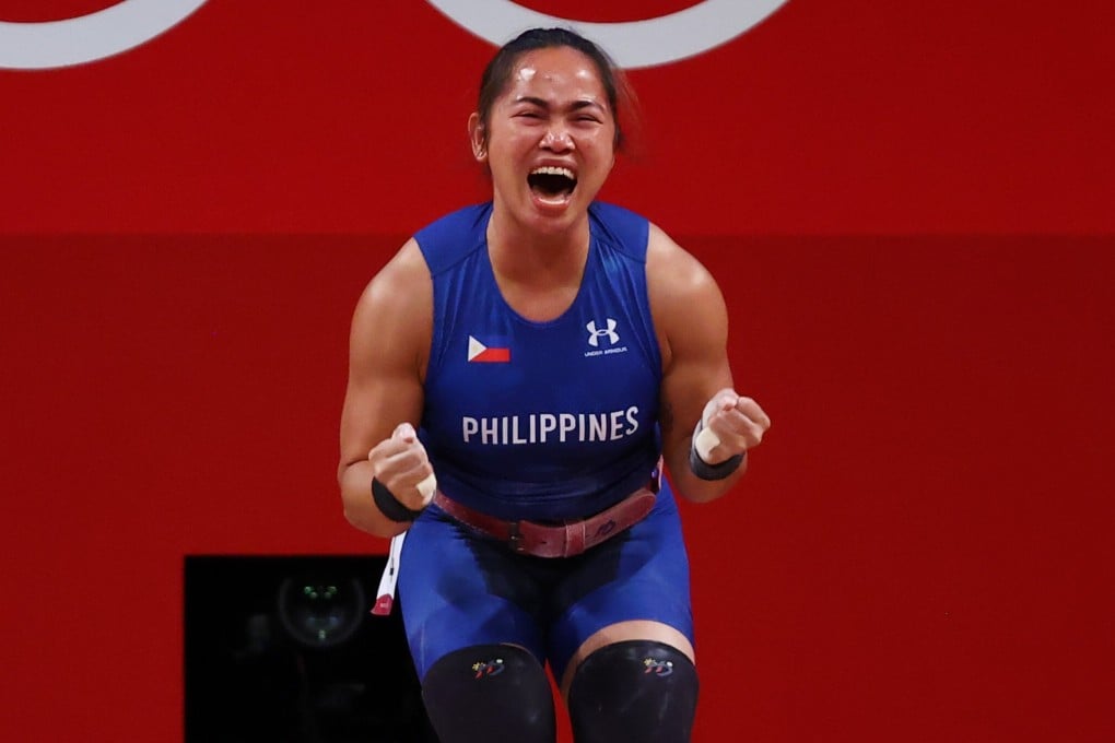 Philippines weightlifter Hidilyn Diaz celebrates soon after making the lift that earned her the 55kg gold medal. Photo: Reuters