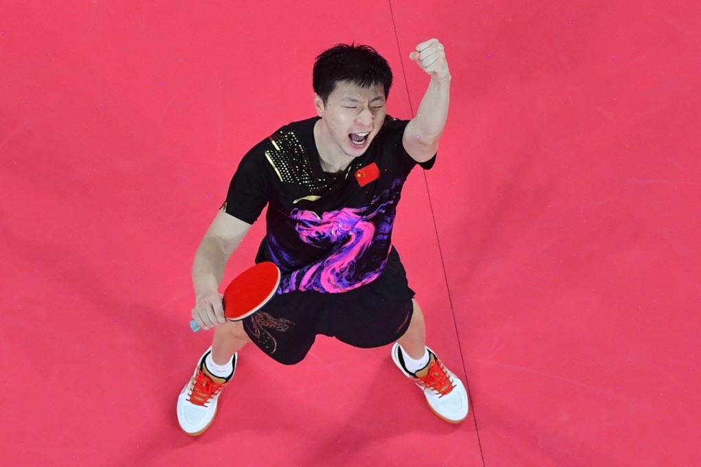 China’s Ma Long celebrates after beating Germany’s Timo Boll for gold in the table tennis men’s team final between at the Tokyo 2020 Olympic Games. Photo: Xinhua