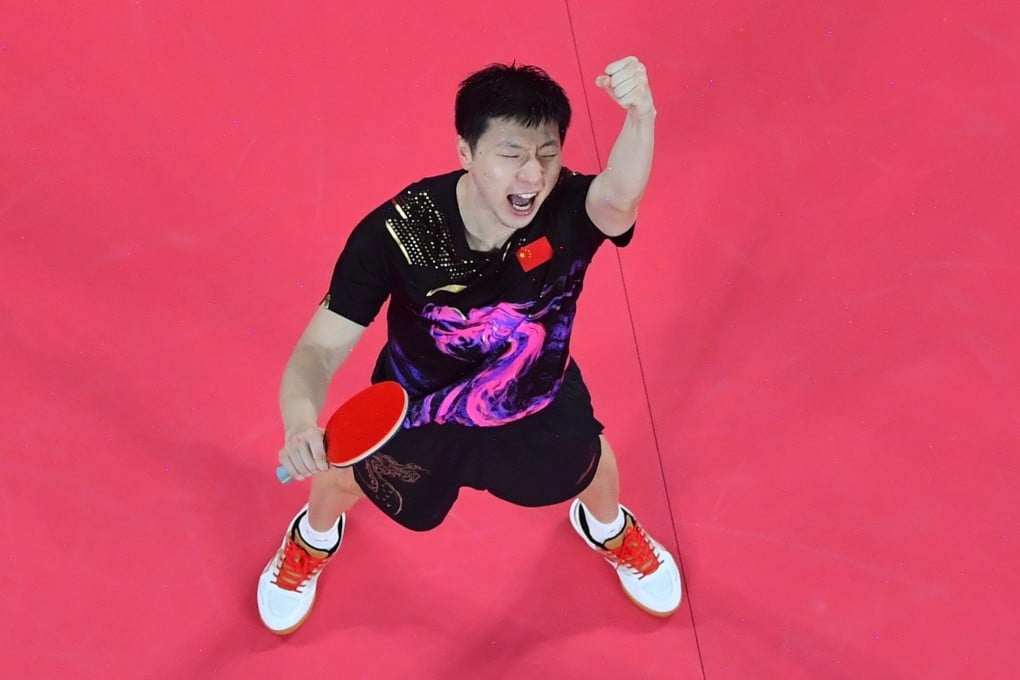 China’s Ma Long celebrates after beating Germany’s Timo Boll for gold in the table tennis men’s team final between at the Tokyo 2020 Olympic Games. Photo: Xinhua