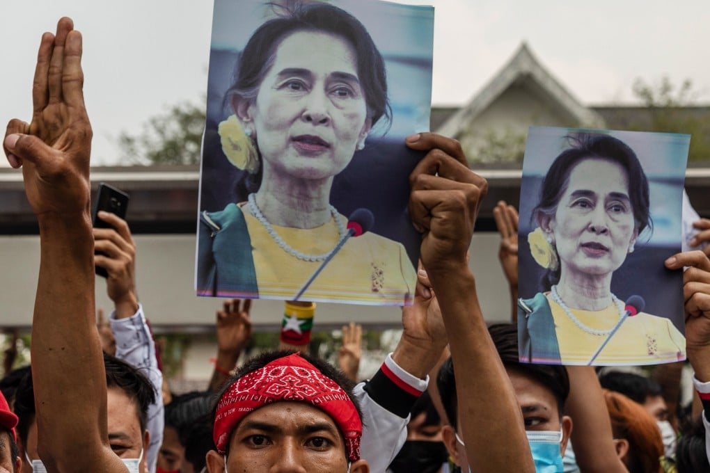 People protest against the military coup in Myanmar. More than 900 people are believed to have been killed and thousands arrested in the military’s crackdown on dissent this year. Photo: DPA