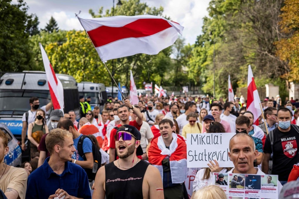 Activists and members of the Belarusian diaspora in Poland take part in a rally in Warsaw on Sunday. Photo: AFP