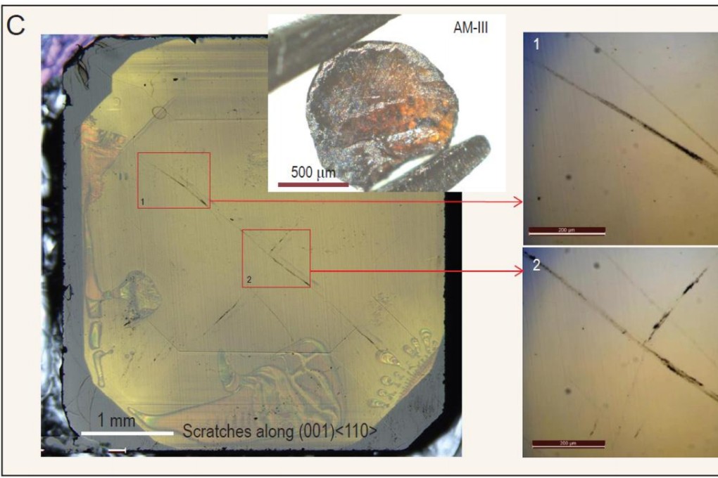 A piece of 1mm-wide AM-III glass made a scratch on the surface of a natural diamond stone. Photo: National Science Review