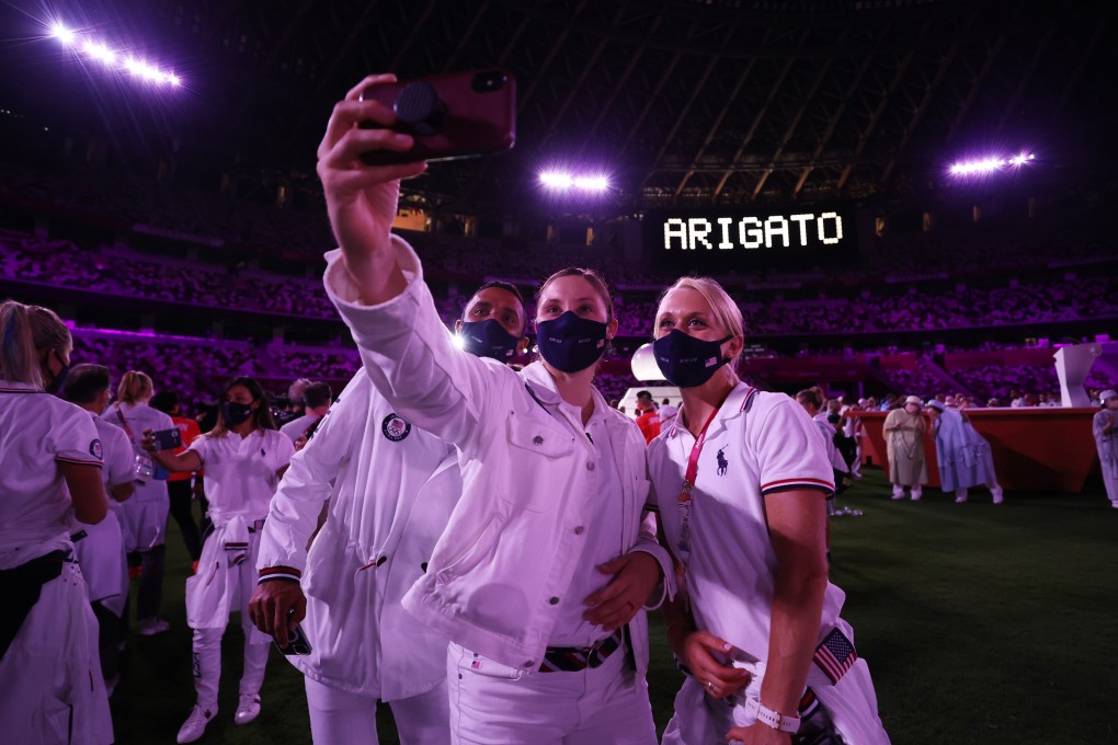 Athletes take a selfie during the closing ceremony of the Tokyo Olympics. Photo: Reuters
