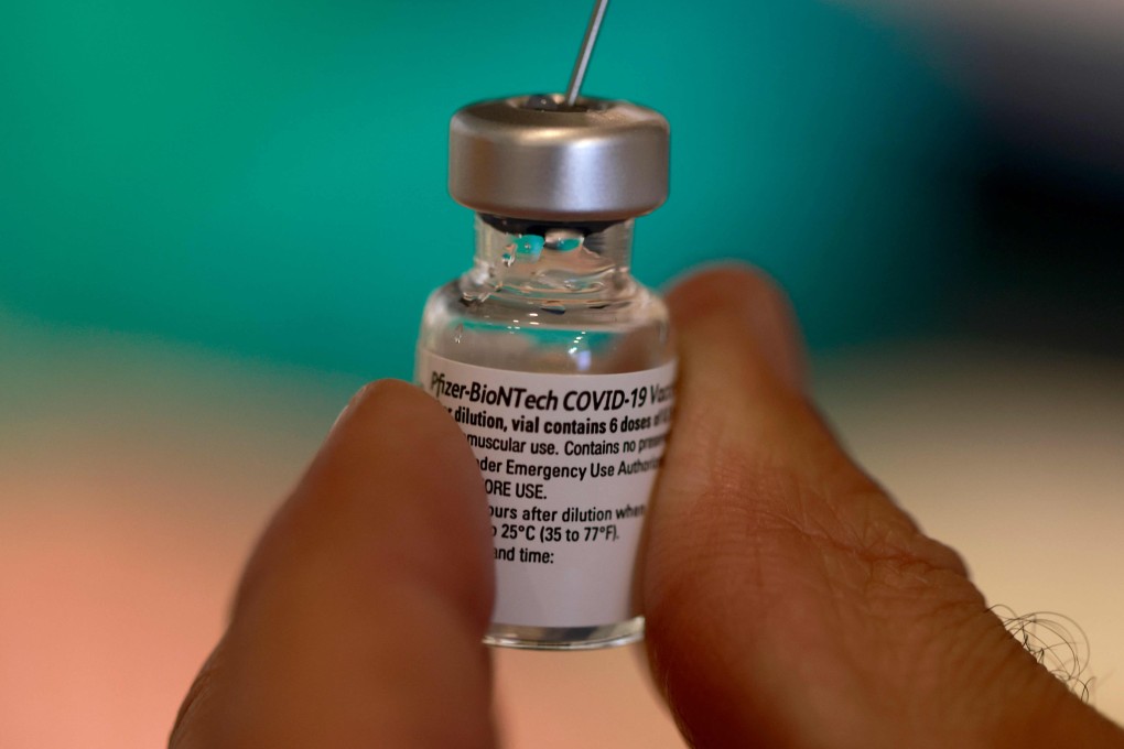A health worker prepares a dose of the Pfizer-BioNTech Covid-19 vaccine. BioNTech says a booster vaccine with the parental coronavirus strain is completely sufficient against the Delta variant. Photo: AFP