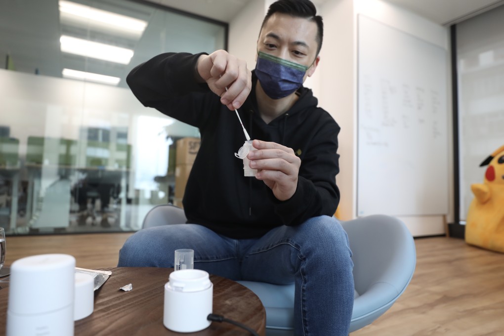 Danny Yeung Sheng-wu, chief executive officer and co-founder of Prenetics Group, demonstrating how a specimen capsule with a nasal swab is placed into a Circle HealthPod for a Covid-19 test, on August 6, 2021. Photo: Xiaomei Chen