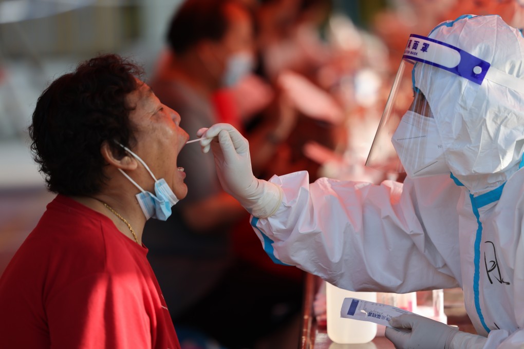 A resident gets tested in Yangzhou, Jiangsu province on Friday. China’s latest outbreak has dampened hopes the borders will fully reopen in the near future. Photo: Xinhua