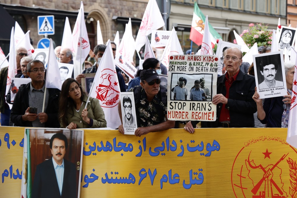 Protesters gather outside court as the trial of Hamid Noury starts in Stockholm. Photo: EPA-EFE